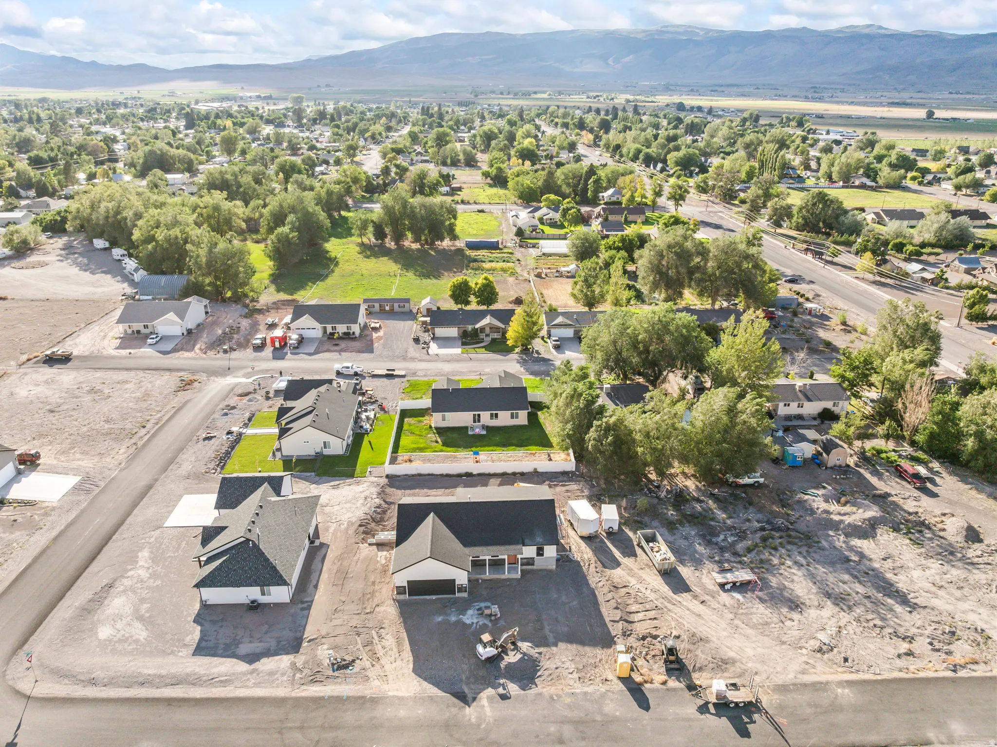 Expansive land parcel featuring new construction residences and developing infrastructure