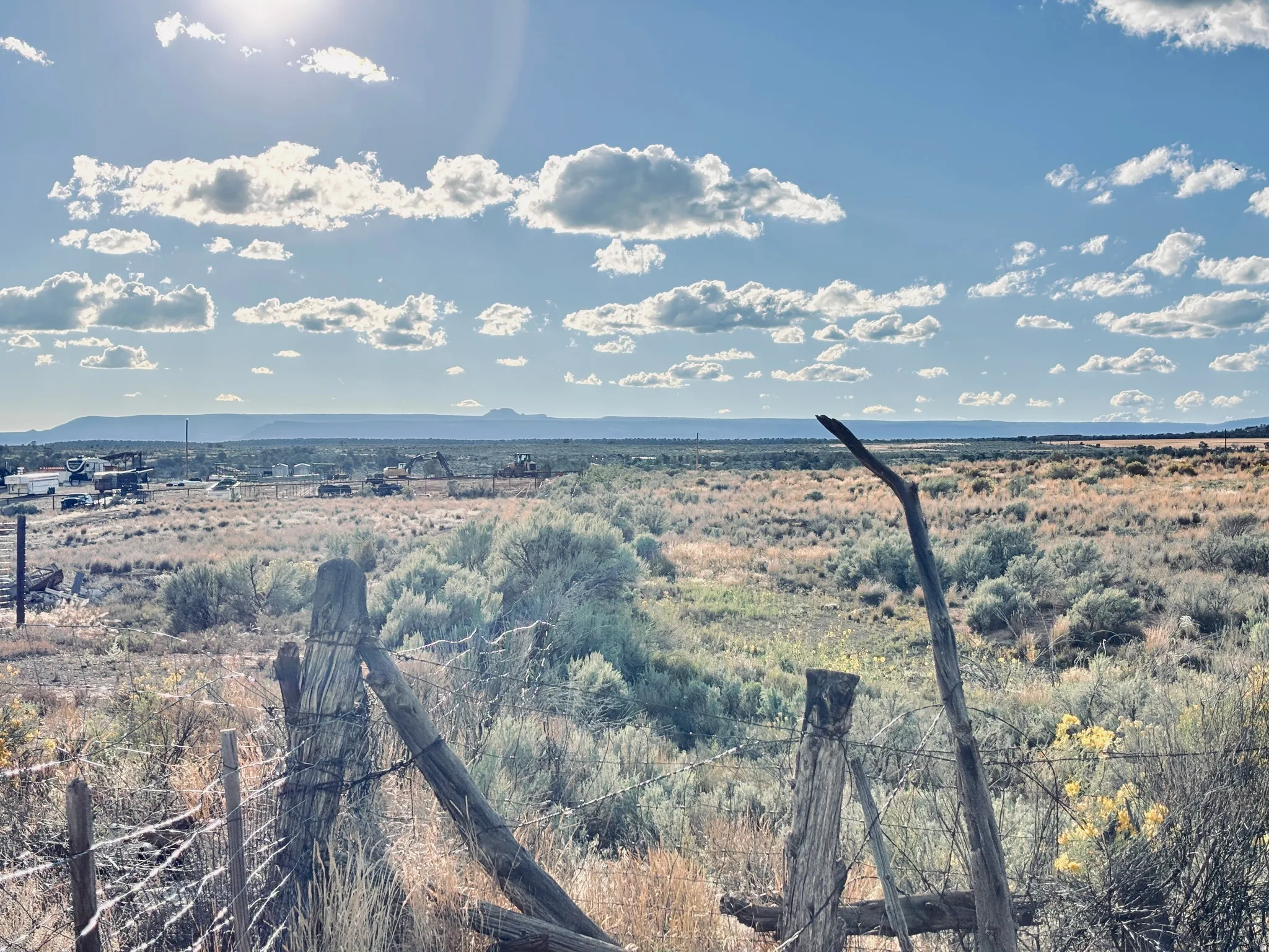 Expansive natural landscape featuring varied terrain and distant mountains
