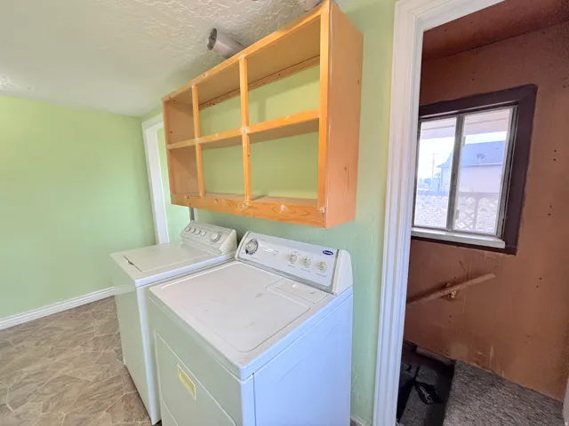 Open wood shelving above appliances