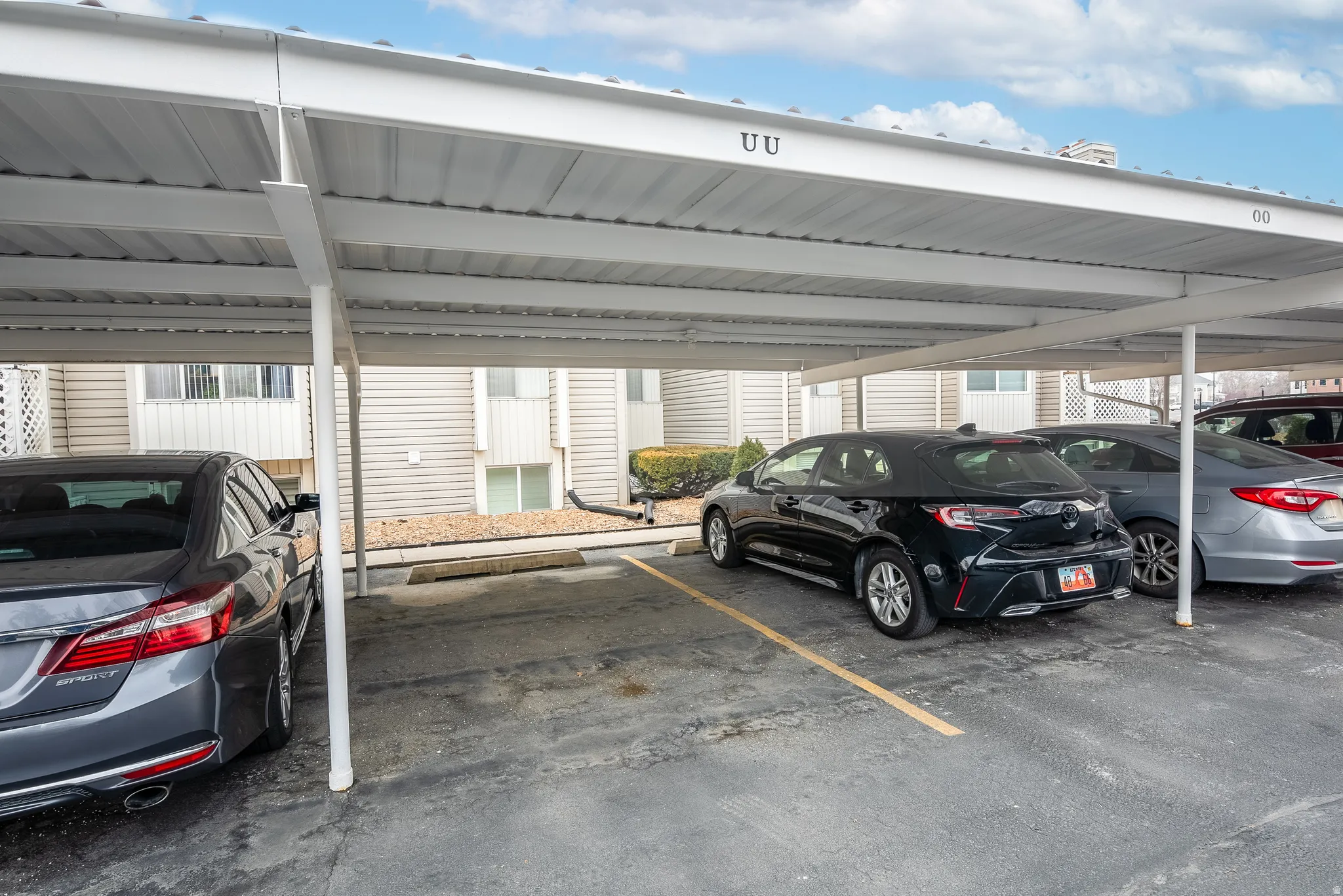 Covered parking structure with designated spaces