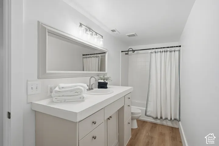 Bathroom with adult height vanity and tub/shower combo
