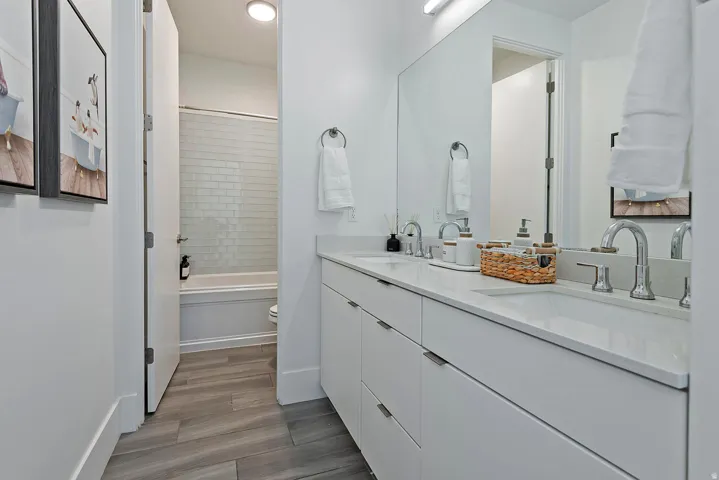 Dual vanity with integrated sinks and white countertops
