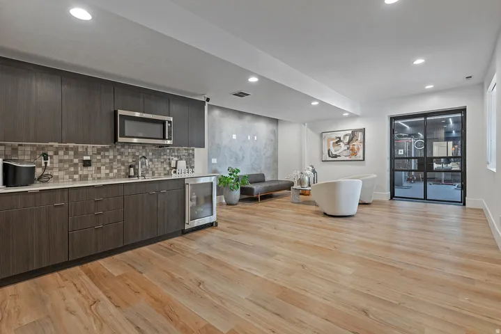 Integrated wet bar with stainless steel microwave and beverage refrigerator