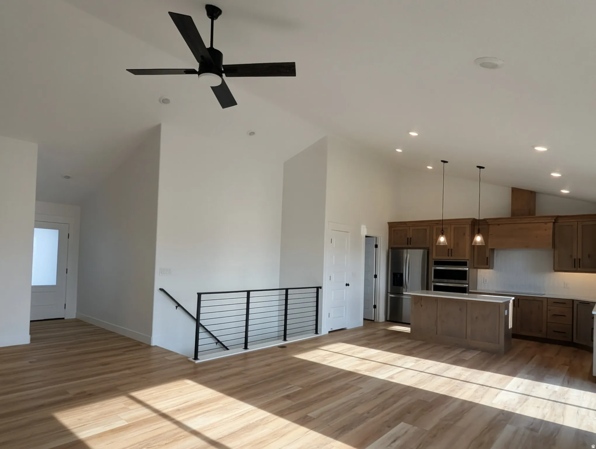 Photo from a previously built Madeline.Entry Way, Living Room, Kitchen.