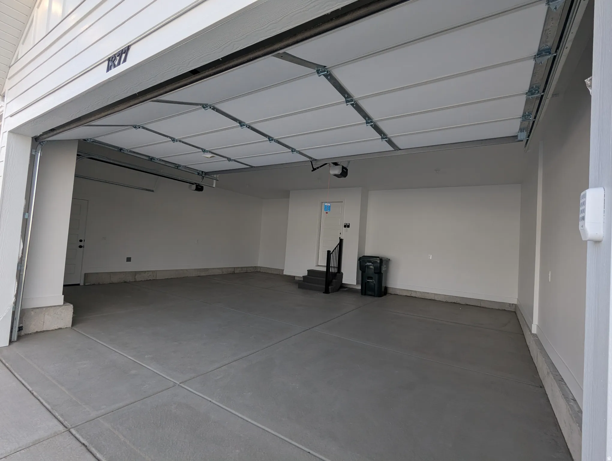 Photo from a previously built Madeline.3 car garage. Walls fully finished including trim.