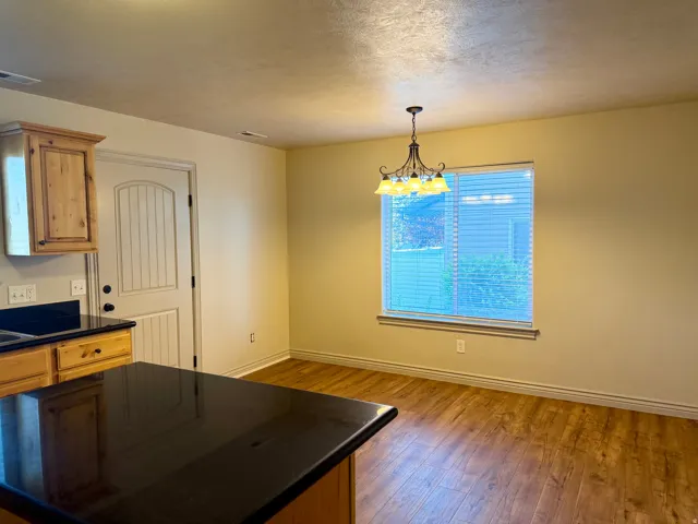 Dining room with an overhead chandelier