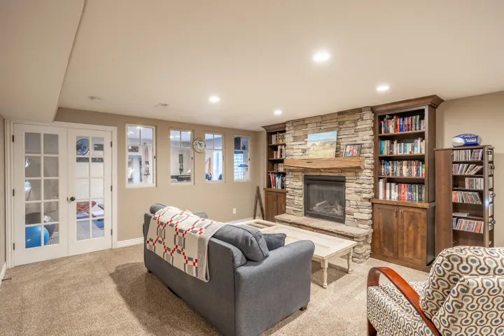Stone fireplace creates a nice cozy conversation area in the family room