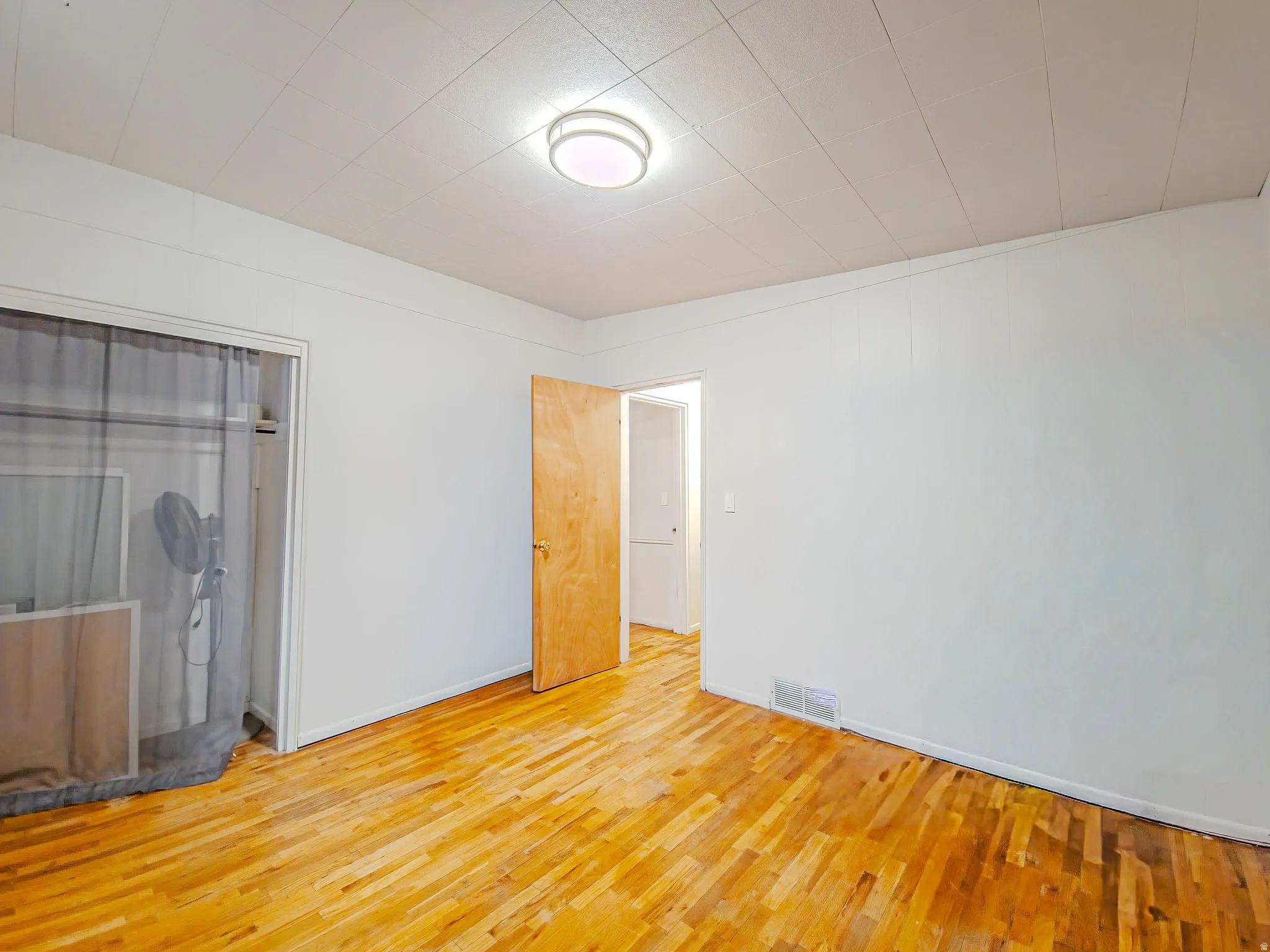 Wood-finish flooring with white walls