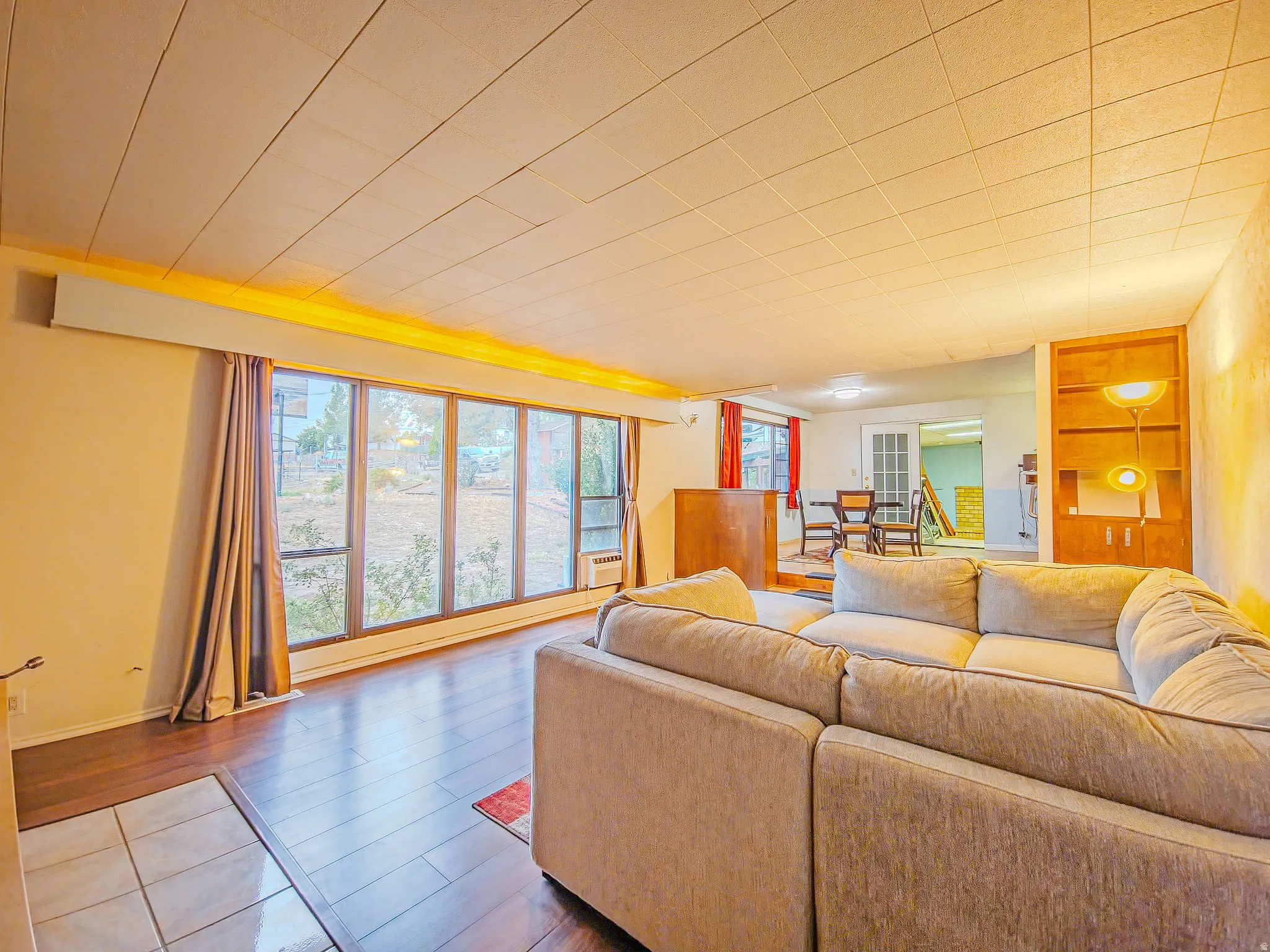 Wood-finish flooring with a tiled entryway