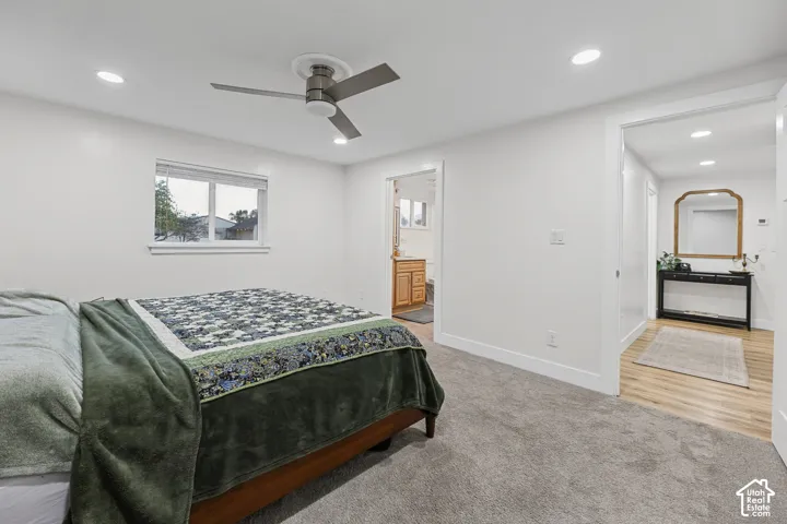 Recessed lighting, ceiling fan, and window offering natural light