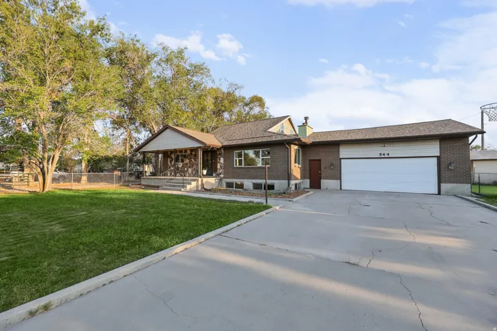 Brick exterior with stone accents and a covered front porch