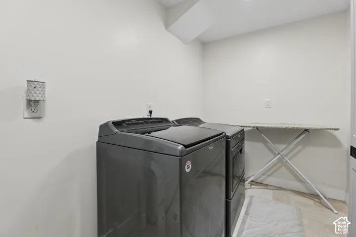 Dedicated laundry area featuring a washer and dryer