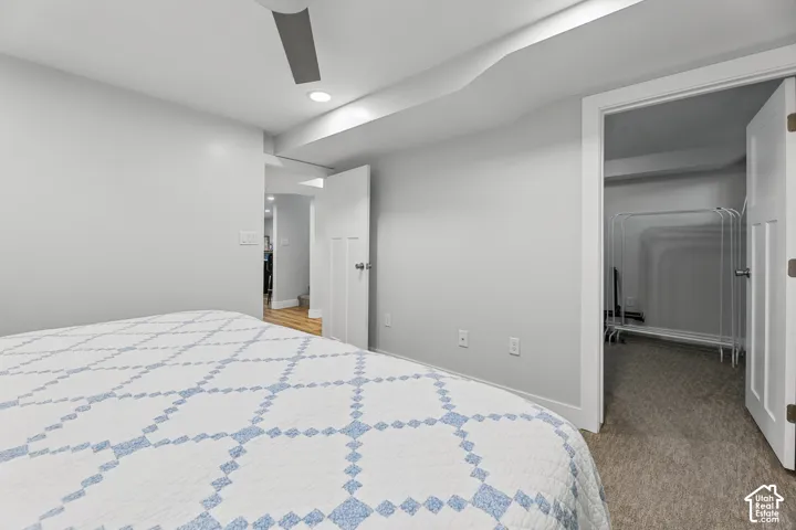 White walls with recessed lighting and a ceiling fan
