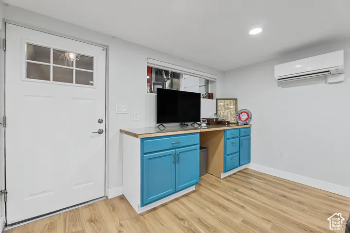 White paneled entry door with transom-style window