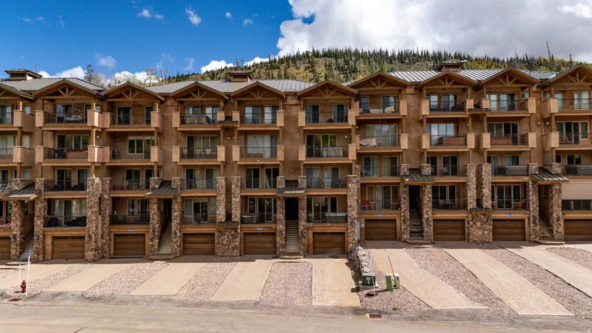 Multi-level building with stone and stucco exterior