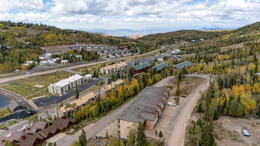 Mountain community featuring multiple residential structures and paved roadways