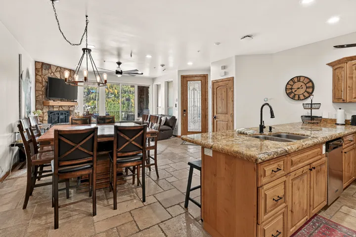 Kitchen island with granite countertop and double stainless steel sink