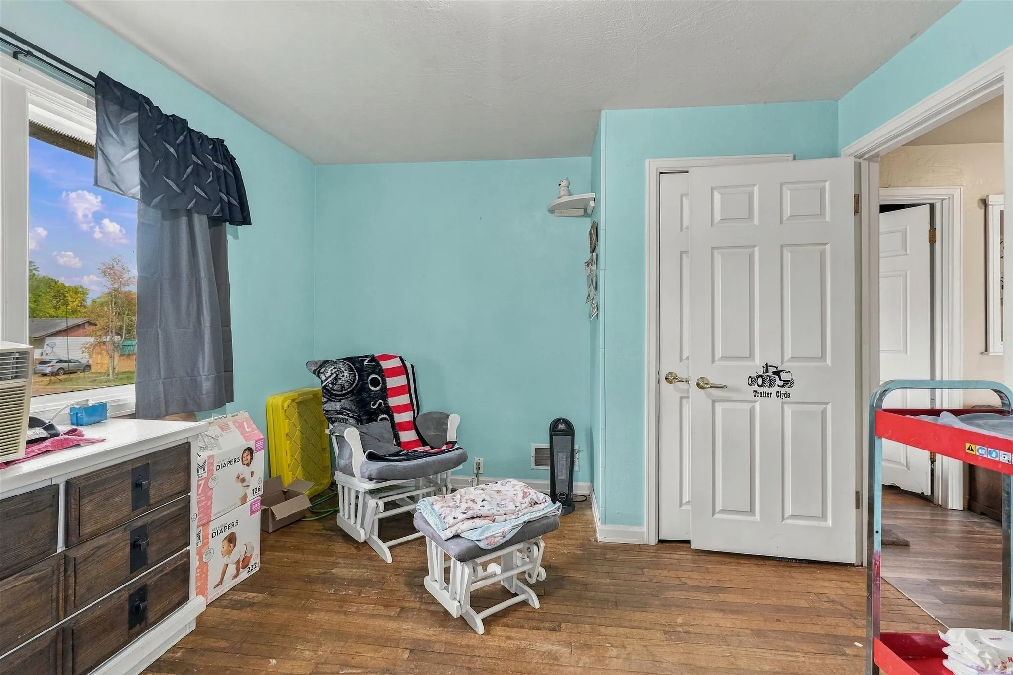 Wood-finish flooring with light blue walls