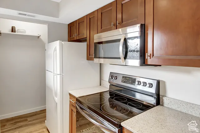 Wood-finish flooring with solid wood cabinetry