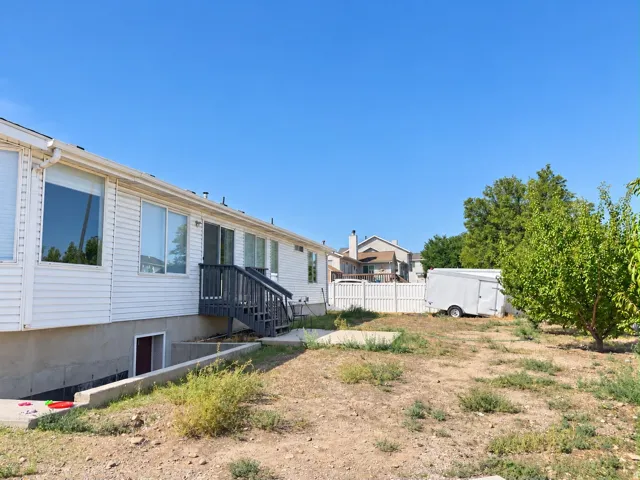 White siding exterior with multiple windows