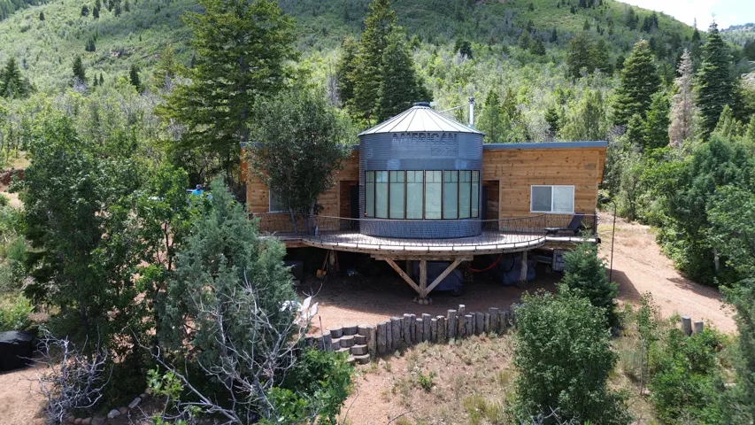 Unique architectural design featuring corrugated metal and natural wood siding