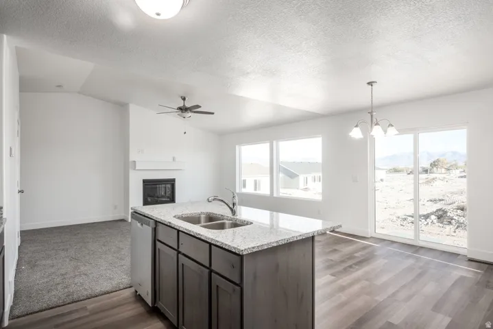 Kitchen island with granite-style countertop and double basin sink