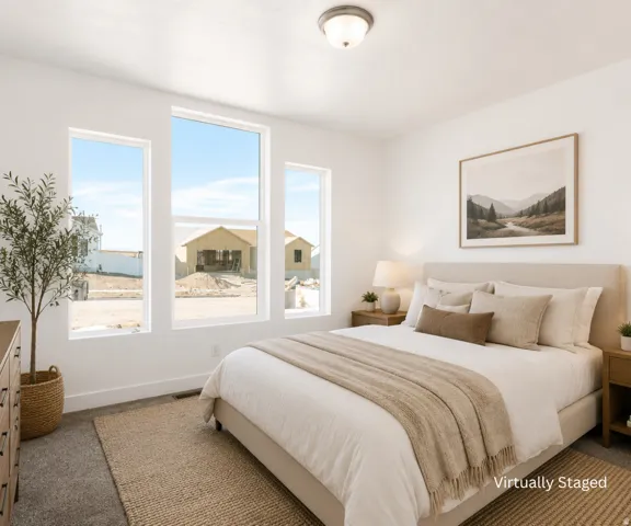 Recessed lighting, multiple large windows, and carpeted flooring