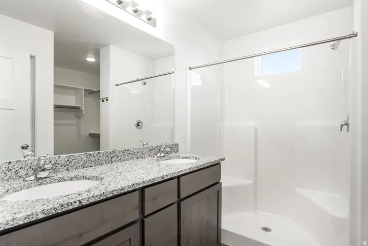Dual vanity with granite-style countertop and integrated sinks