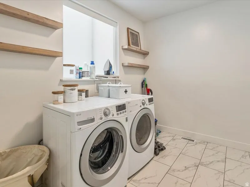 White tiled flooring, light-toned walls, and recessed window