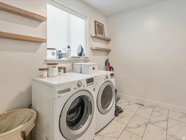 White tiled flooring, light-toned walls, and recessed window