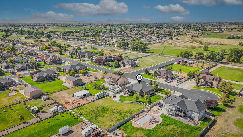 Aerial perspective showcasing the residential neighborhood with varied architectural styles and surrounding green spaces