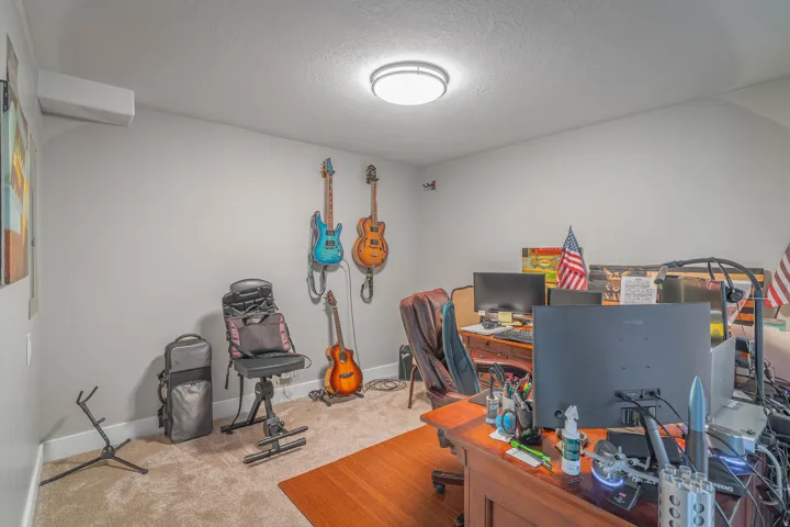 Neutral-toned walls with ceiling-mounted lighting