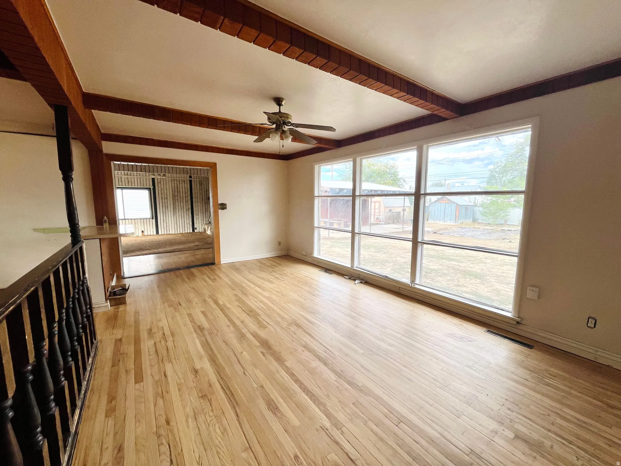 Dining room featuring hardwood floors and a built-in bar area.
