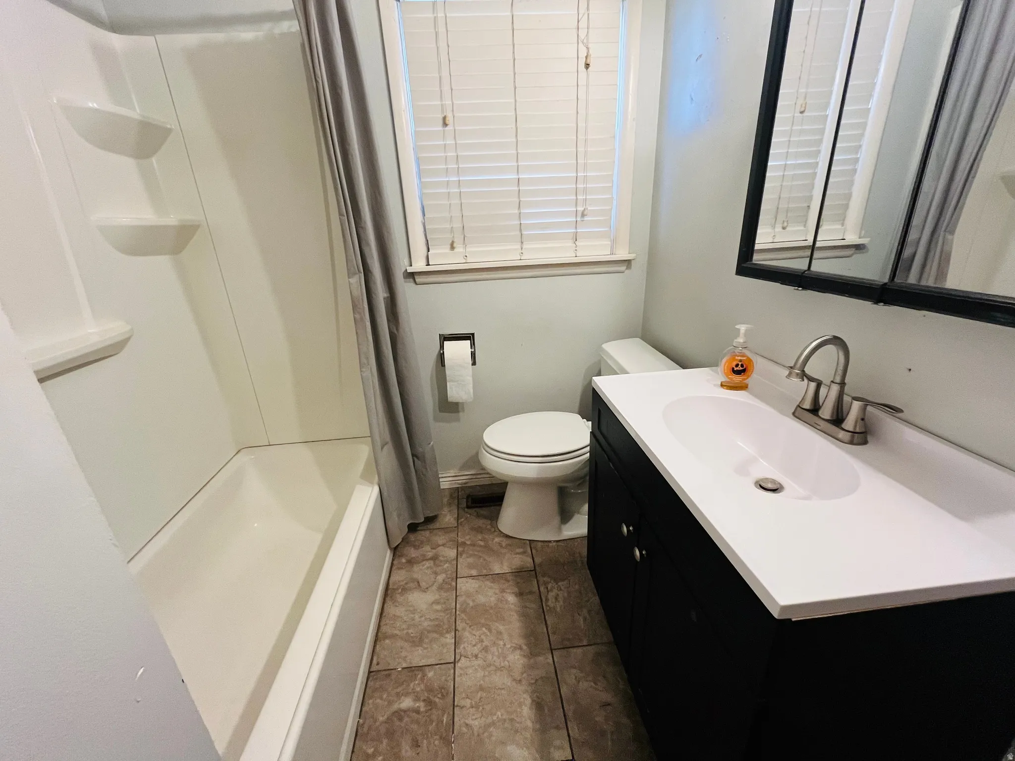 Convenient full bathroom with tub and shower.