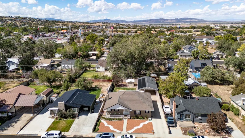 Residential property with established landscaping and a paved driveway