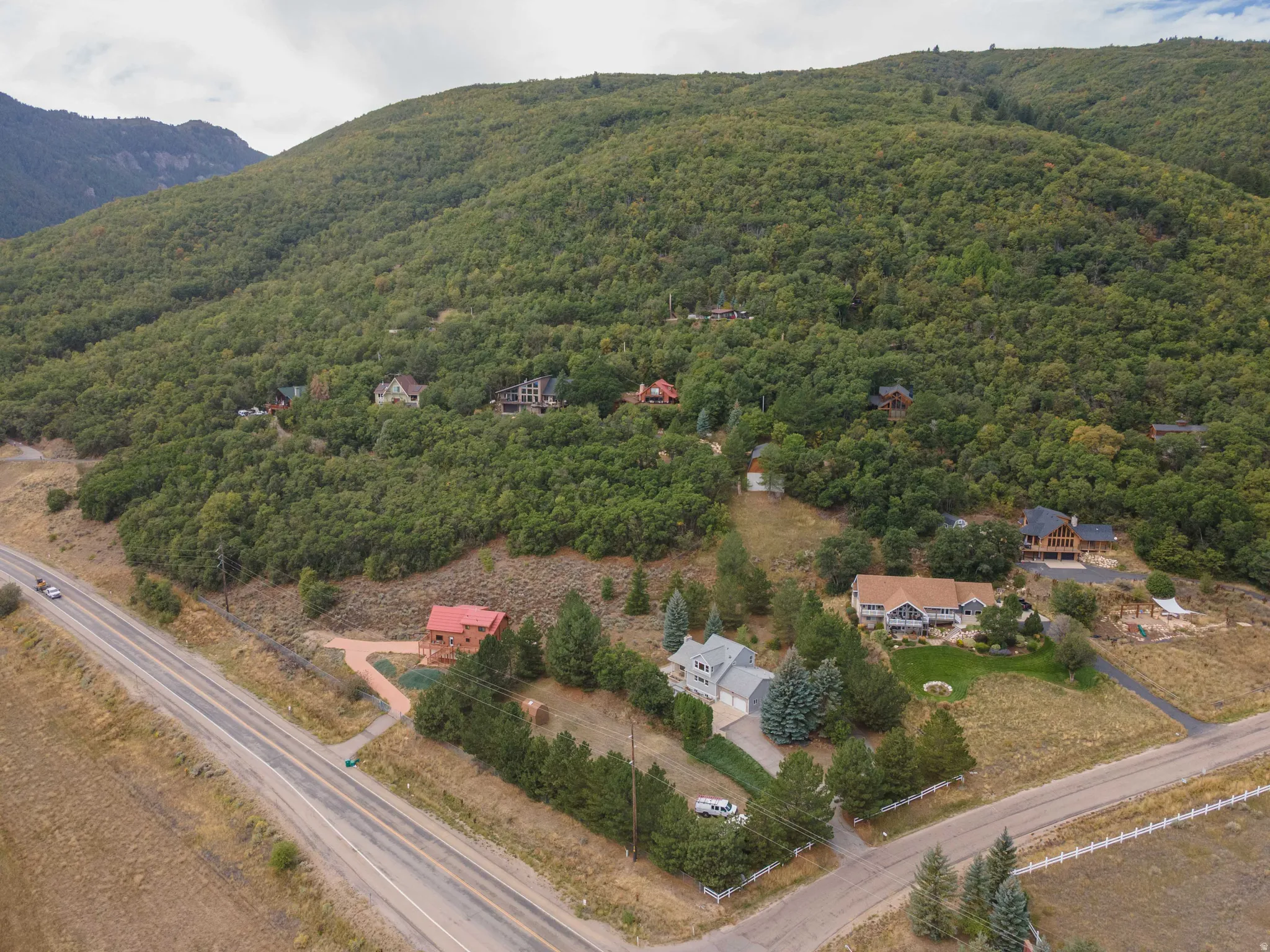 Mountainous landscape with treed hillsides and established residences
