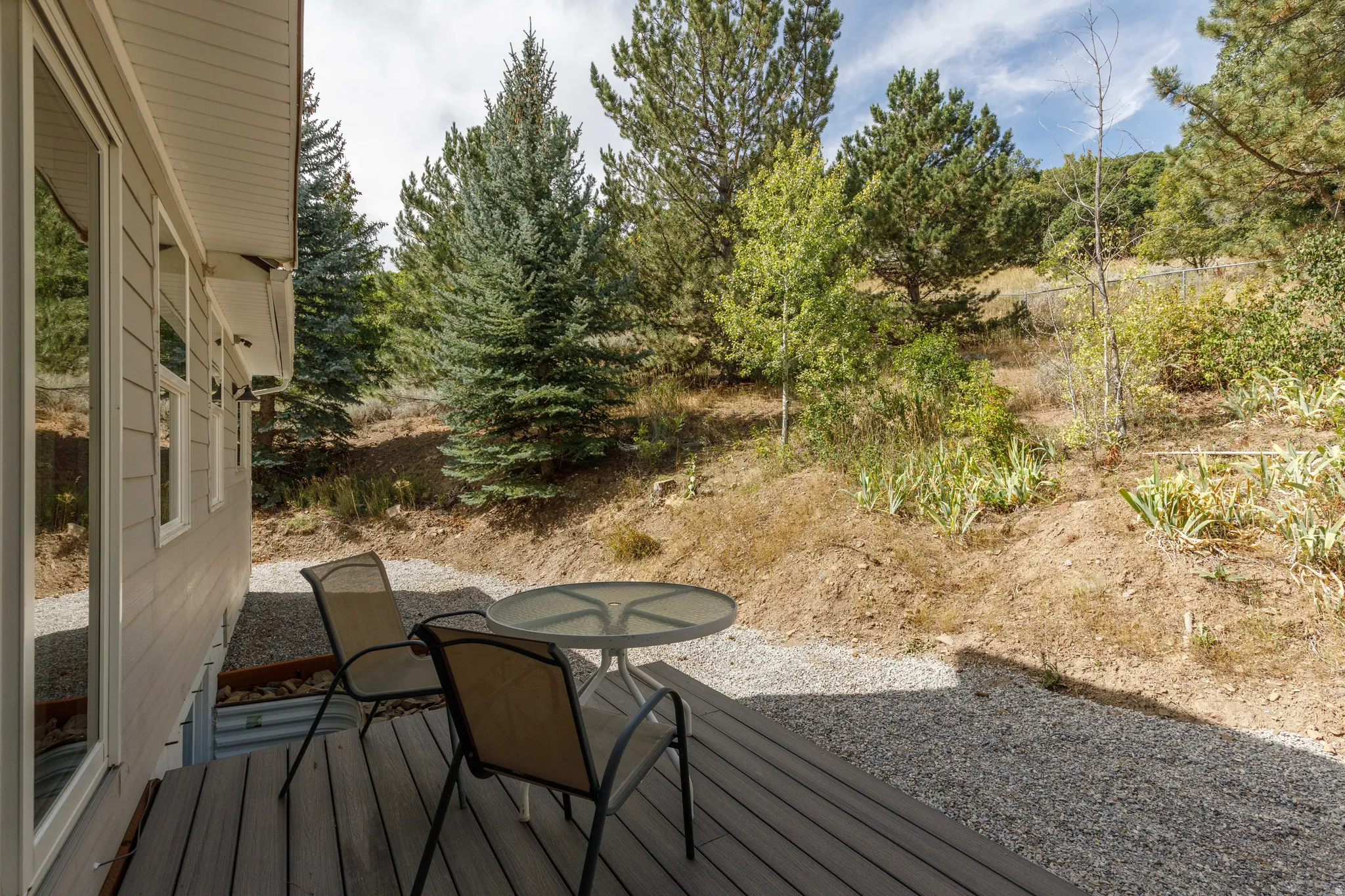 Wood-finish decking with a gravel ground cover