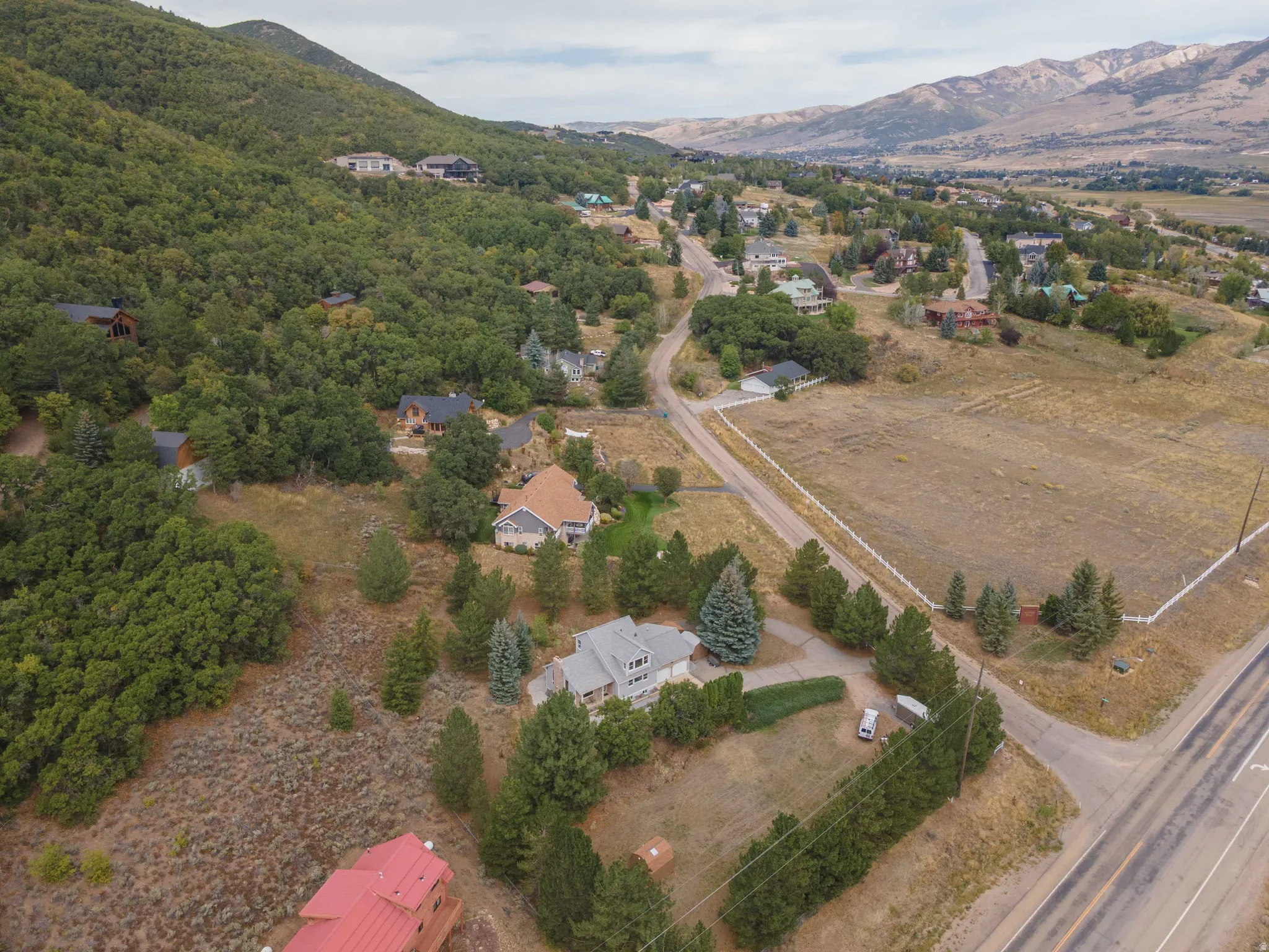 Expansive mountain landscape with scattered residential properties