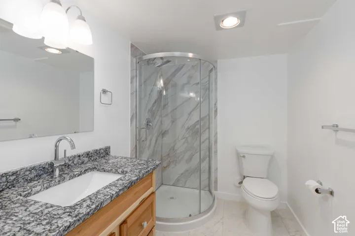 Vanity with granite countertop and undermount sink