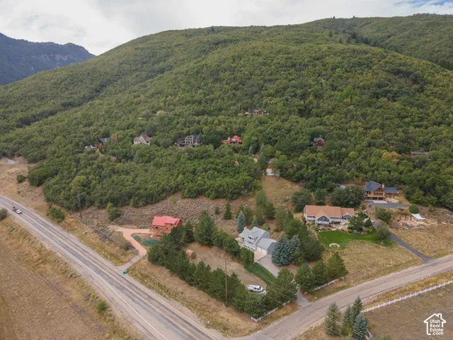 Mountainous landscape with treed hillsides and established residences