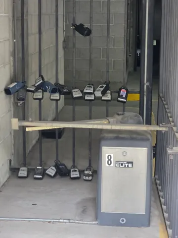 Lockbox next to wall by parking garage entry gate