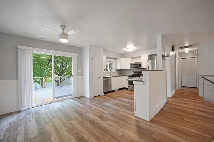 Kitchen featuring white cabinetry, stainless steel appliances, and a built-in microwave