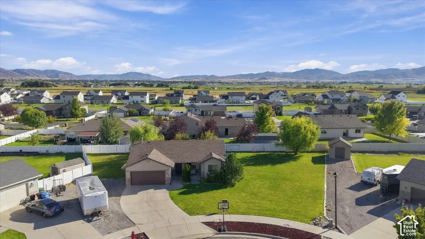 Spacious lot with a well-maintained lawn and mature trees