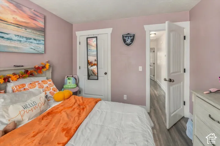 White paneled interior doors, light-colored walls, and wood-finish flooring