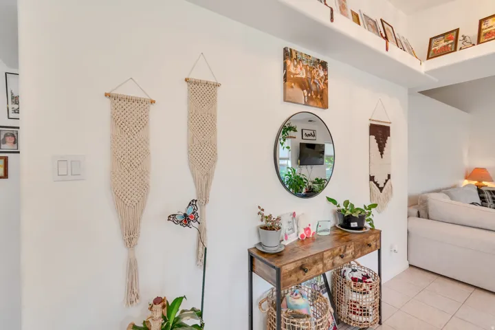Recessed wall shelving and an entryway console table with a wood-finish top