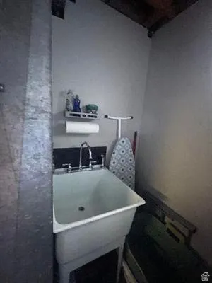 Utility sink with chrome faucet