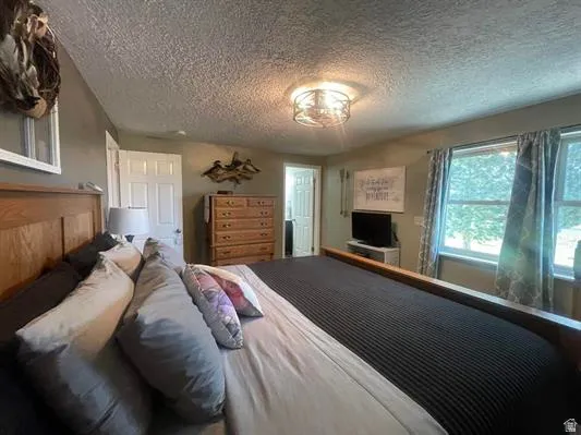 Recessed lighting, light-colored walls, and multiple windows