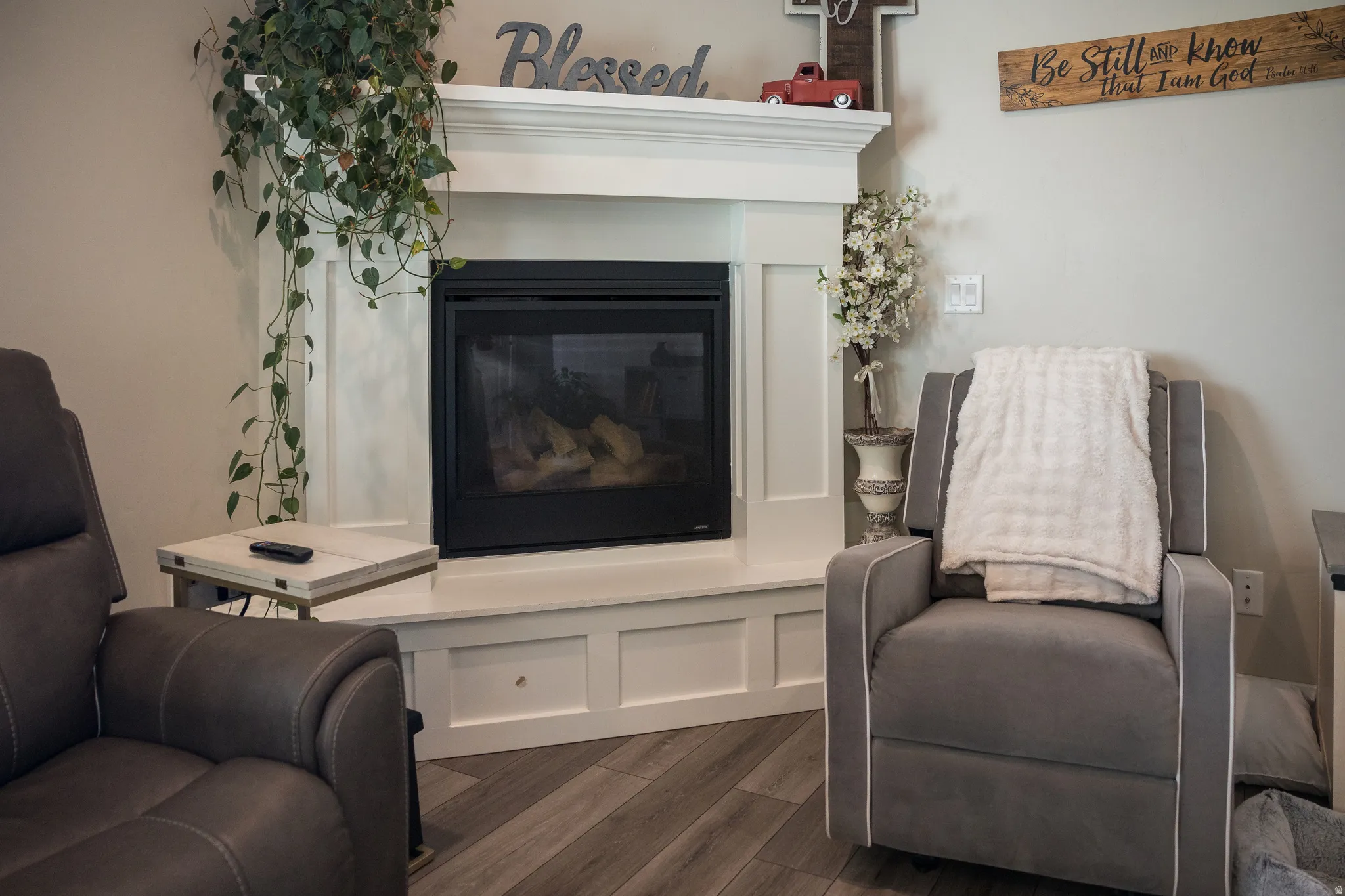 White-painted fireplace surround with a dark-faced firebox