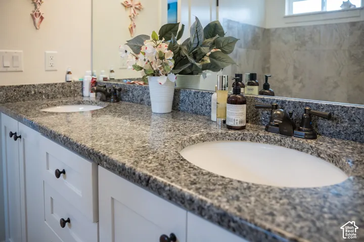 Dual undermount sinks with bronze-finish fixtures