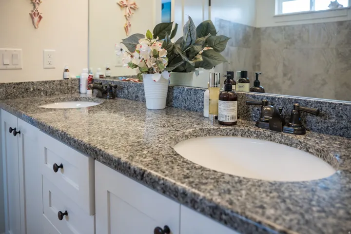 Dual undermount sinks with bronze-finish fixtures
